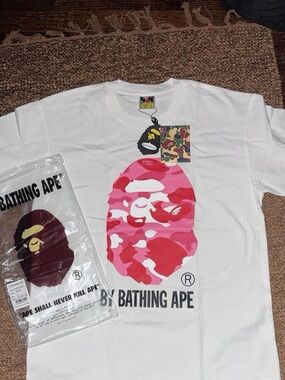 A Bathing Ape White Tee with Pink Camo Ape Head Graphic